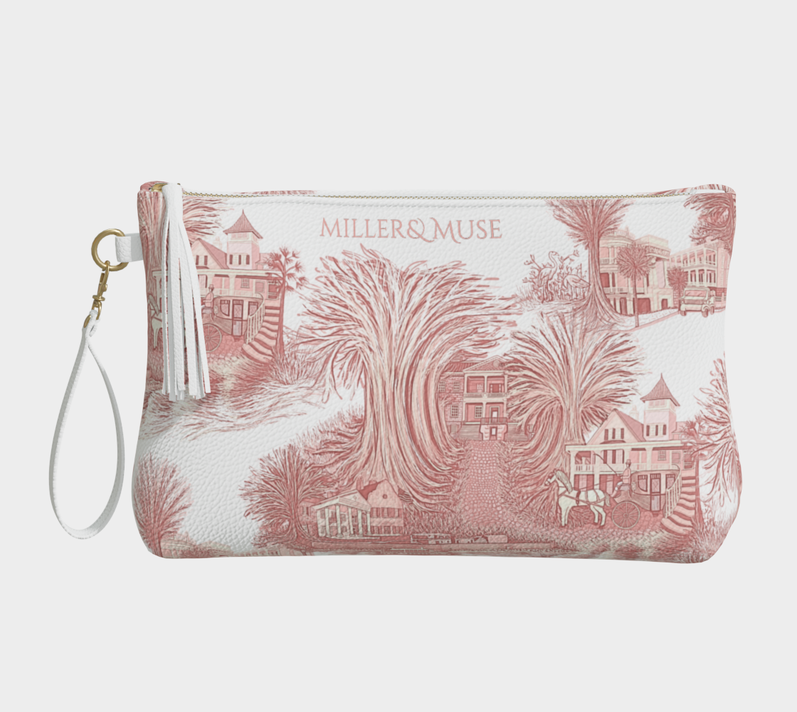 A pink and white pebble textured cosmetic case with a wristlet that features a hand-drawn toile de jouy style print of Middleton Place Plantation, Boone Hall Plantation, Magnolia Plantation, Drayton Hall Plantation, the Battery, Fort Sumter and the pinapple fountain in CHarleston SC as well as natural landscape elements of the area like liveoaks.