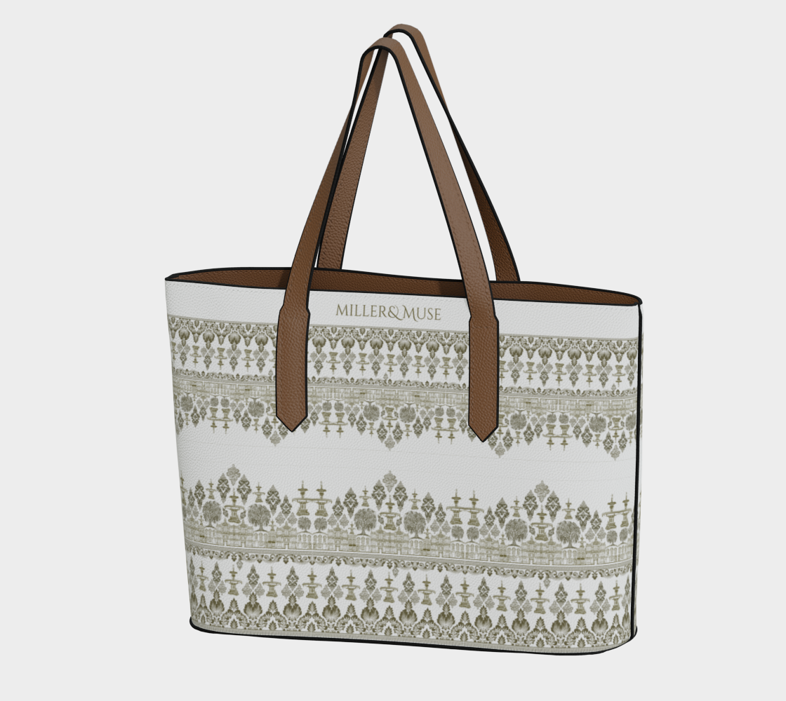 A hand-drawn damask style print pebble textured tote bag with the text 'MILLER&MUSE' on the front, featuring iconic architecture and natural scenery of Savannah, Georgia like the forsyth fountain and the savannah cotton exchange building.
